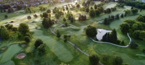 aerial of the golf course with morning mist